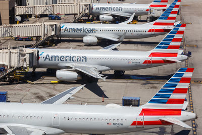 High angle view of airplane on airport runway