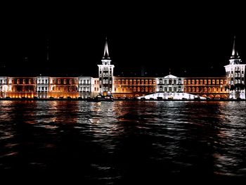 View of illuminated city at waterfront