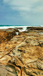 Scenic view of beach against sky