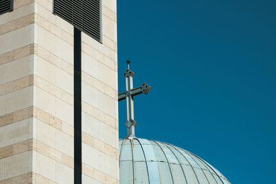 Low angle view of traditional building against clear blue sky