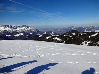 Scenic view of snowcapped mountains against sky