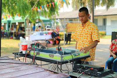 Man working on table in city