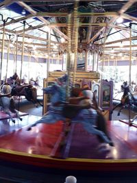 Blurred motion of people at amusement park