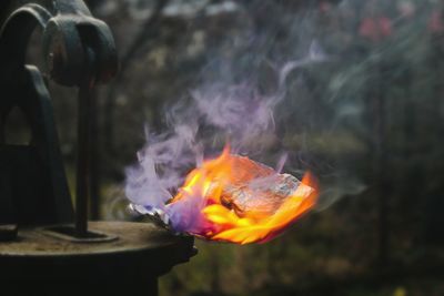 Close-up of burning candles in temple