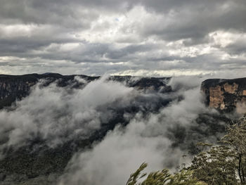 View of clouds over landscape against cloudy sky