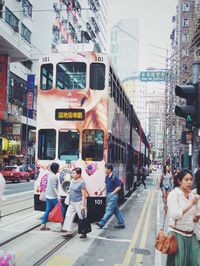 People walking on street in city