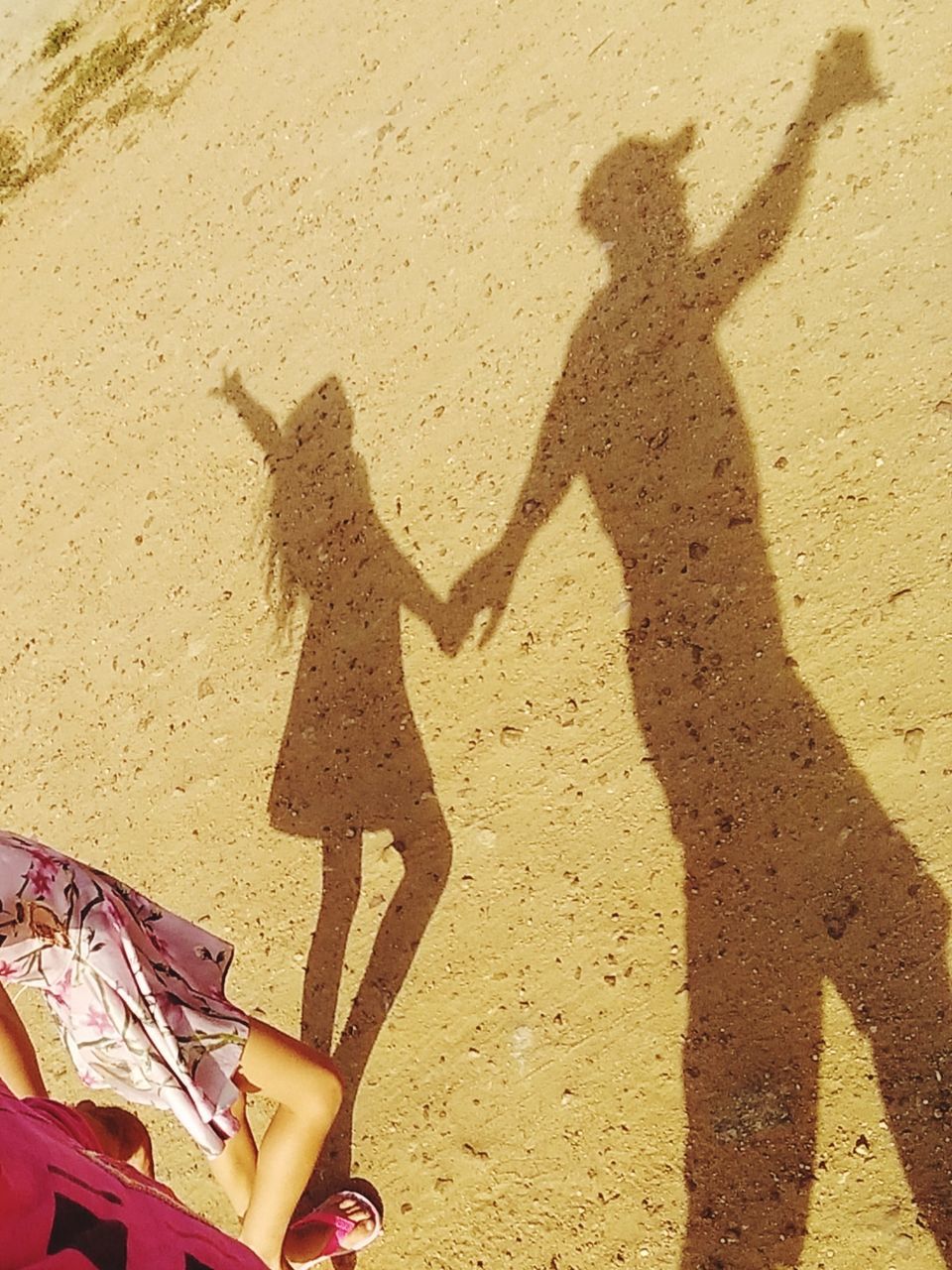 sunlight, shadow, land, two people, beach, real people, nature, lifestyles, women, sand, togetherness, high angle view, leisure activity, adult, people, standing, low section, day, men, human leg, focus on shadow