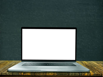 Close-up of laptop on table