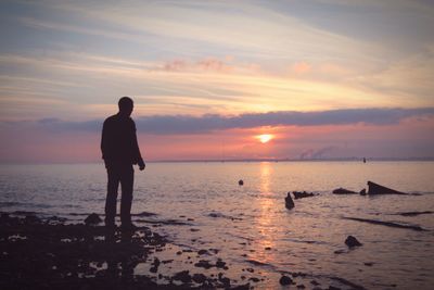 Scenic view of sea at sunset