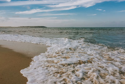 Scenic view of beach against sky