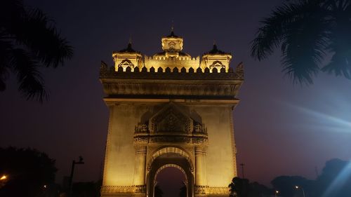 Low angle view of illuminated building at night