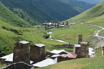 High angle view of village amidst houses and mountains