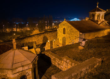 High angle view of illuminated buildings in city at night