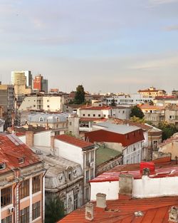 High angle view of buildings in city against sky