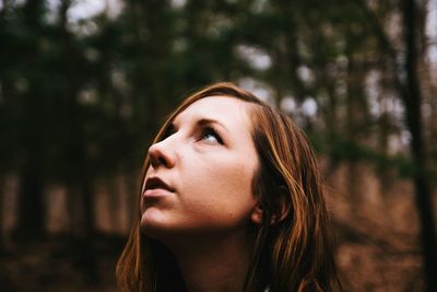 Close-up of young woman looking away