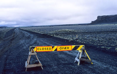 Empty road with mountains in background