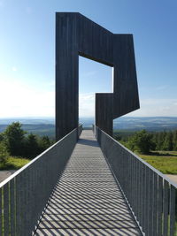 Bridge over sea against sky