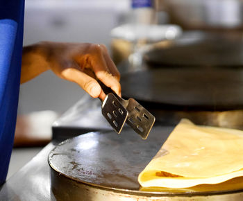 Close-up of man preparing food