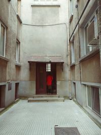 Man in front of building