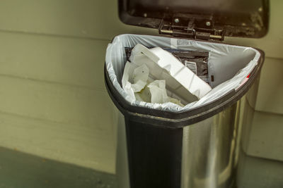 High angle view of garbage can on table