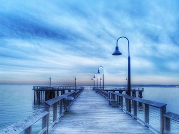 Pier over sea against sky
