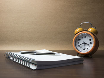 High angle view of clock on table