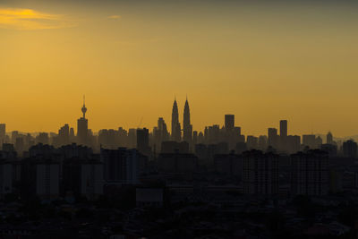 View of cityscape against sky during sunset