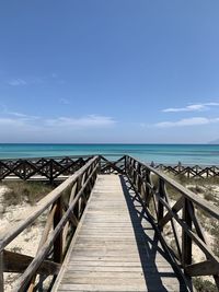 Pier over sea against sky