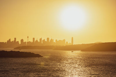 Sunset shot of sydney harbour with cbd in the background, seen from fairfax lookout at north head.