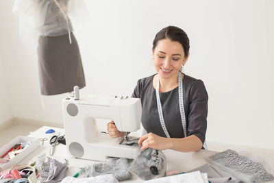 Mid adult woman working in office