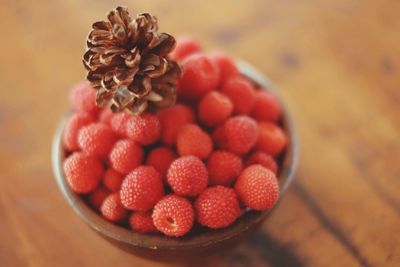 High angle view of strawberries in bowl on table