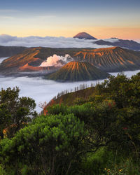 Scenic view of mountains against cloudy sky