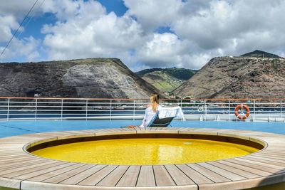 Scenic view of mountains against cloudy sky