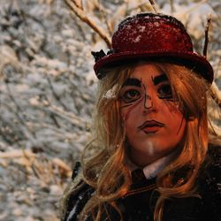 Close-up portrait of woman in snow