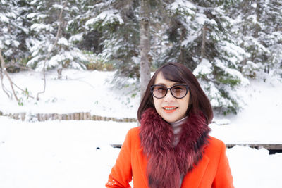 Portrait of young woman in snow