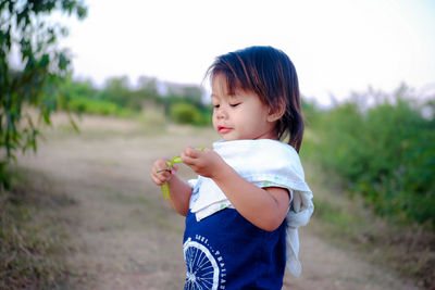 Cute girl standing on field