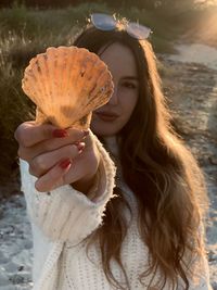 Portrait of woman holding ice cream