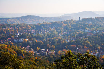 Aerial view of town and trees in autumn