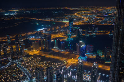 High angle view of illuminated buildings in city at night