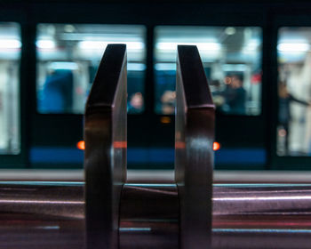 Close-up of train at illuminated railroad station