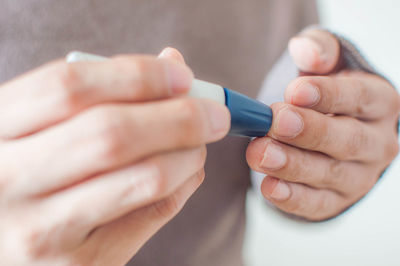 Close-up of woman holding hands