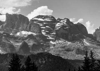 Snow capped peaks of cloud shrouded rocky mountains