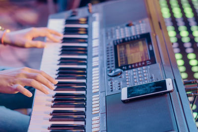 Close-up of hand on piano keys