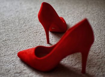 High angle view of red shoes on rug