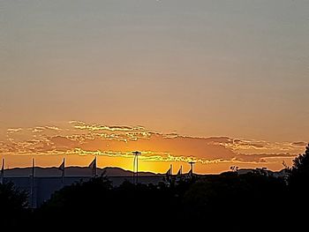 Scenic view of silhouette mountains against sky during sunset