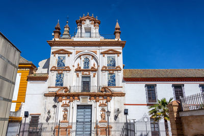 Low angle view of building against blue sky