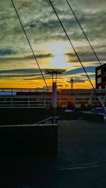 Scenic view of city against sky during sunset