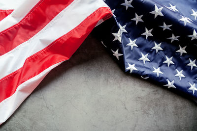 High angle view of flags against blue wall