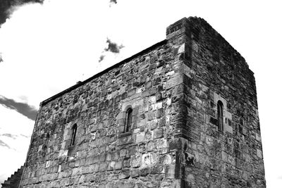 Low angle view of old building against sky