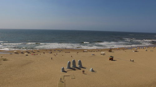 Scenic view of beach against clear sky